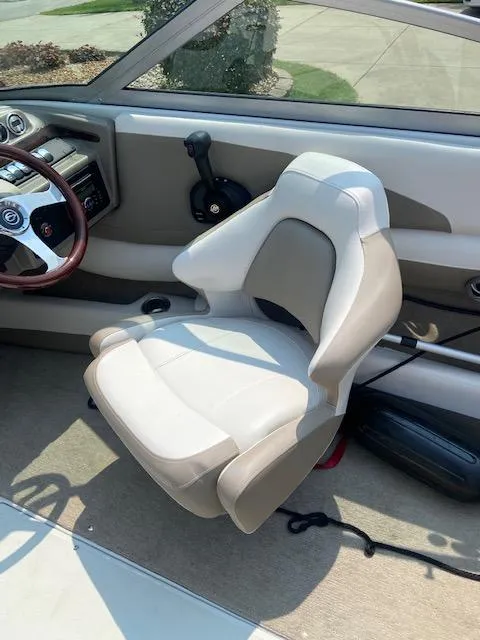 Slide: The Image of Interior of a 2014 Crownline 215 SS boat with steering seat. - 5