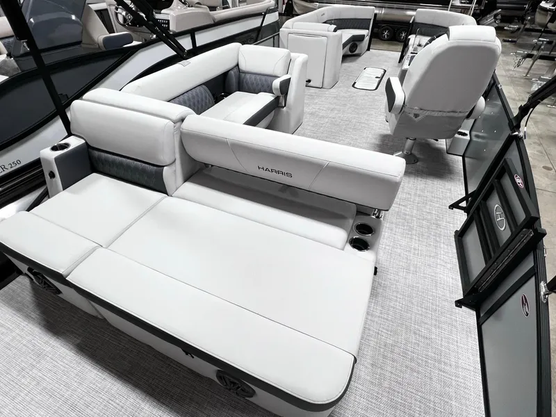 Slide: The Image of 2024 Harris Sunliner 250 boat interior with luxurious seating and modern design. - 14
