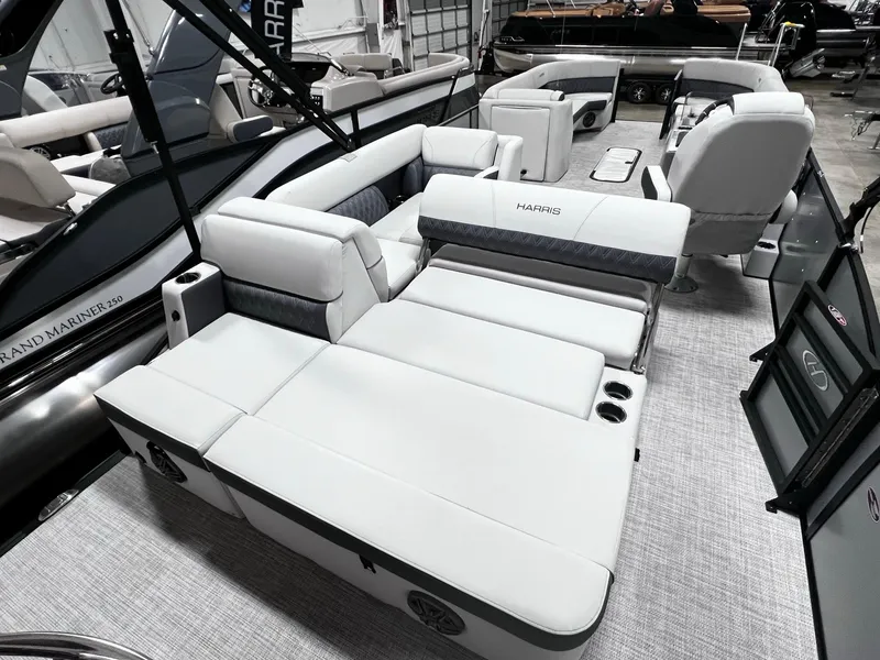 Slide: The Image of 2024 Harris Sunliner 250 boat interior with luxurious white seating and modern design. - 15