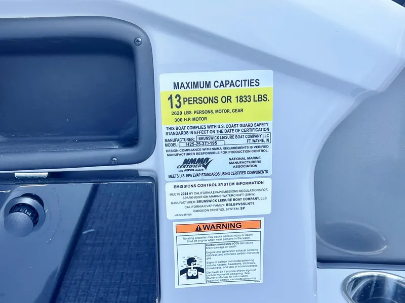 Slide: The Image of 2024 Harris Sunliner 250 capacity label, maximum 13 persons or 1833 lbs. - 18