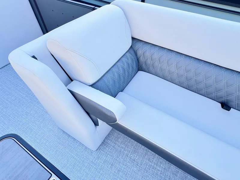 Slide: The Image of 2024 Harris Sunliner 250 boat interior with elegant quilted seating. - 21