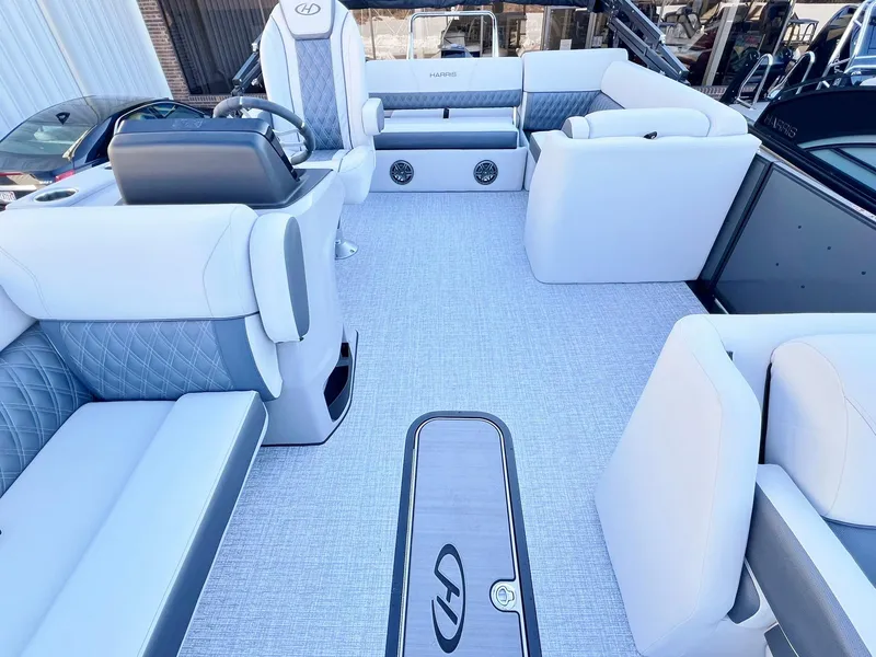 Slide: The Image of 2024 Harris Sunliner 250 boat interior with luxurious seating and modern design. - 22
