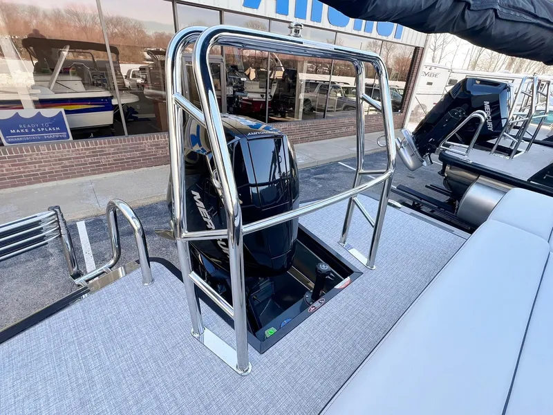 Slide: The Image of 2024 Harris Sunliner 250 boat with sleek engine and modern design. - 25