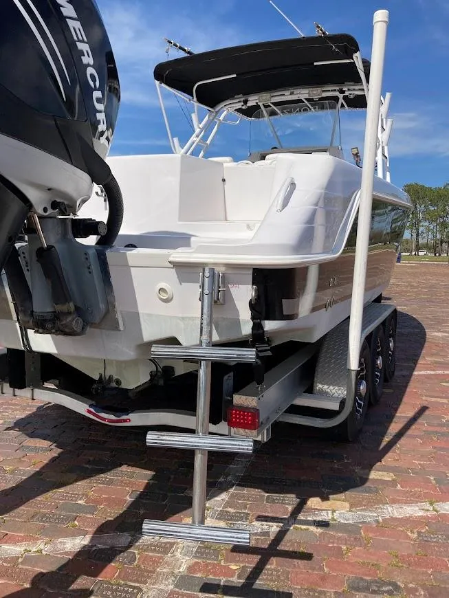 Slide: The Image of 2005 Donzi 35 ZFC Daytona boat with Mercury engine, parked on brick pavement. - 10