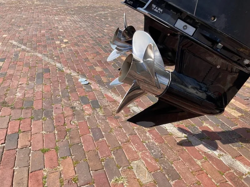 Slide: The Image of 2005 Donzi 35 ZFC Daytona boat propellers on brick pavement. - 12