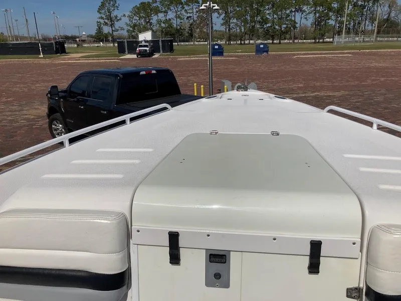 Slide: The Image of 2005 Donzi 35 ZFC Daytona boat on trailer, parked near black truck. - 17