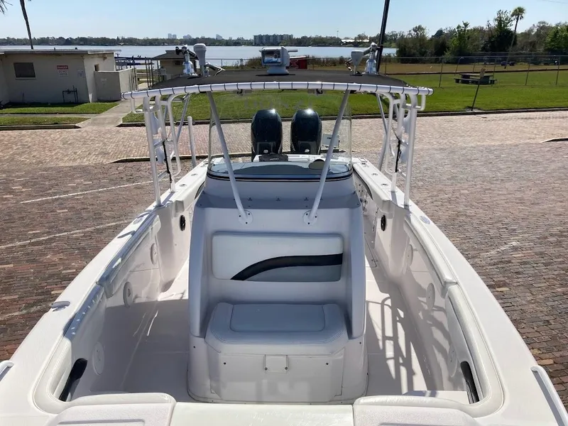 Slide: The Image of 2005 Donzi 35 ZFC DAYTONA boat, white interior, docked near waterfront. - 18