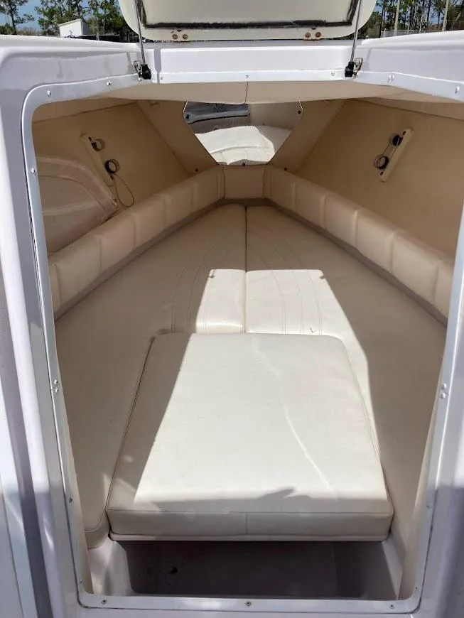 Slide: The Image of Interior cabin of 2005 Donzi 35 ZFC DAYTONA boat, featuring cushioned seating. - 19