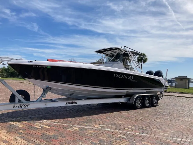 Slide: The Image of 2005 Donzi 35 ZFC Daytona boat on trailer, parked on brick pavement. - 2