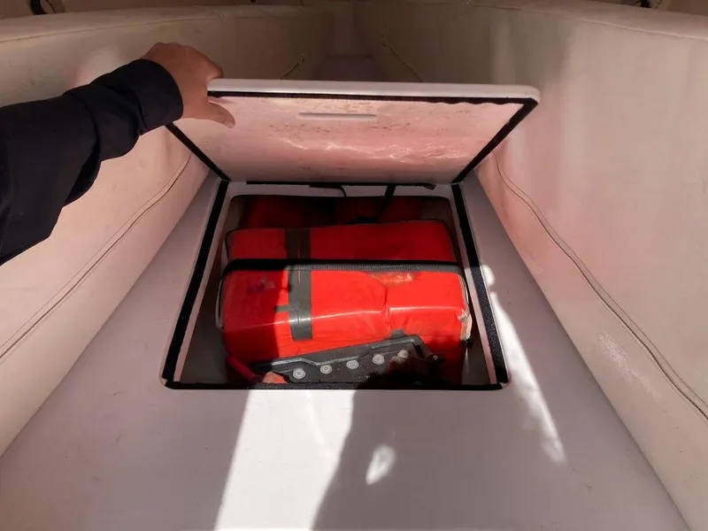 Slide: The Image of Storage compartment on 2005 Donzi 35 ZFC DAYTONA boat with life jackets inside. - 22