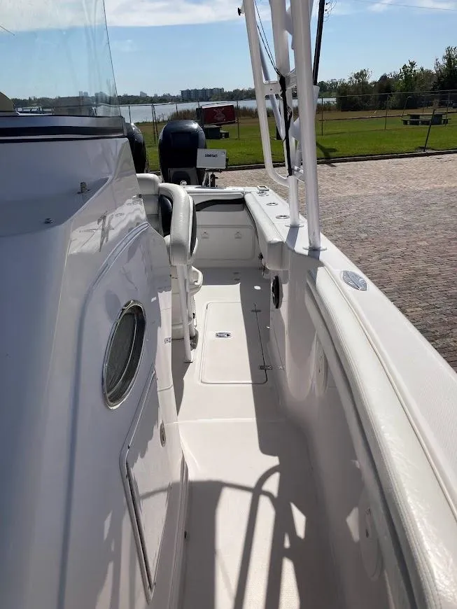 Slide: The Image of 2005 Donzi 35 ZFC DAYTONA boat deck, white exterior, sunny day, waterfront view. - 24