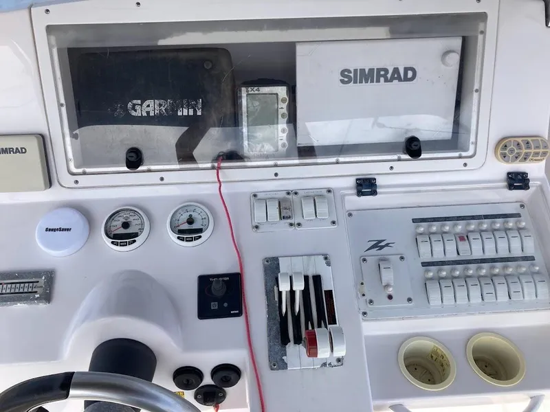 Slide: The Image of Control panel of 2005 Donzi 35 ZFC DAYTONA with Simrad and Garmin navigation systems. - 28