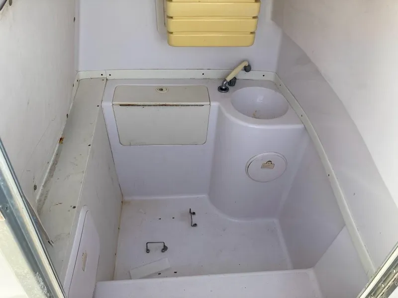 Slide: The Image of 2005 Donzi 35 ZFC DAYTONA boat interior with sink and storage compartments. - 30