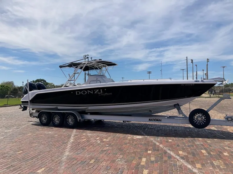 Slide: The Image of 2005 Donzi 35 ZFC Daytona boat on trailer, parked on brick pavement. - 4