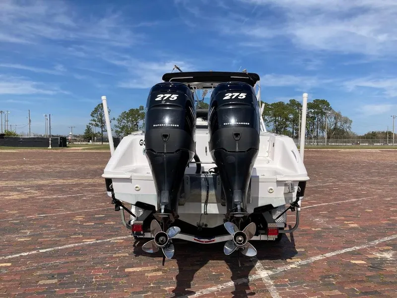 Slide: The Image of 2005 Donzi 35 ZFC Daytona with twin 275 horsepower engines, parked on brick pavement. - 6