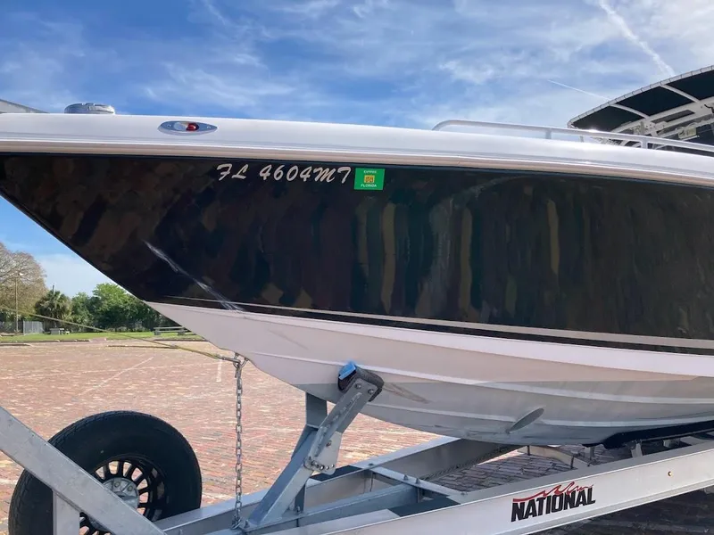 Slide: The Image of 2005 Donzi 35 ZFC Daytona boat on trailer, side view, sunny day. - 8