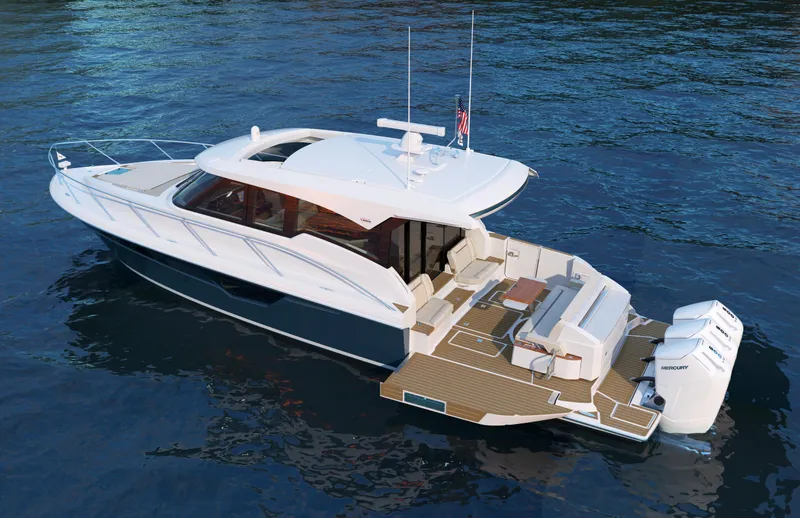 Slide: The Image of 2025 Tiara Yachts 48LE luxury boat on water, showcasing sleek design and spacious deck. - 11