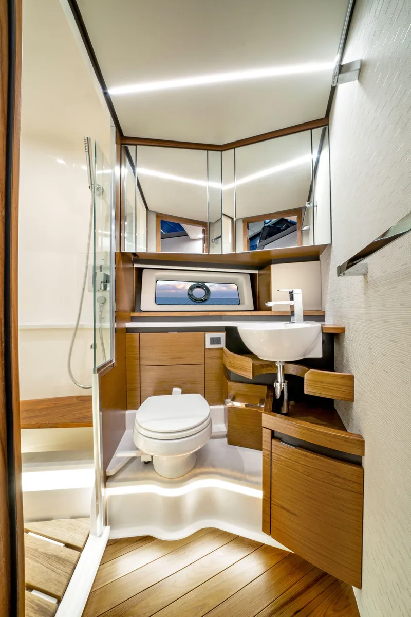 Slide: The Image of Modern bathroom in 2025 Tiara Yachts 48LE with sleek design and wooden accents. - 7