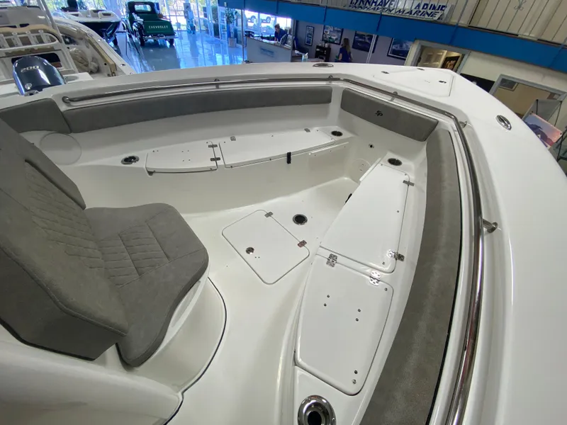 Slide: The Image of 2023 Sea Pro 259 Deep V CC boat interior with seating and storage compartments. - 5