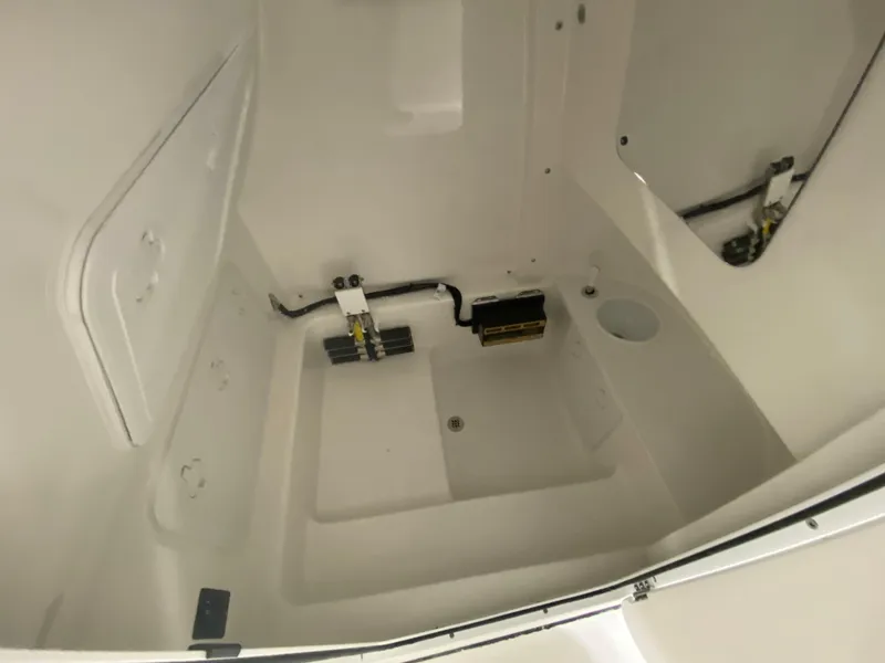 Slide: The Image of 2023 Sea Pro 259 Deep V CC interior compartment with wiring and drainage. - 6