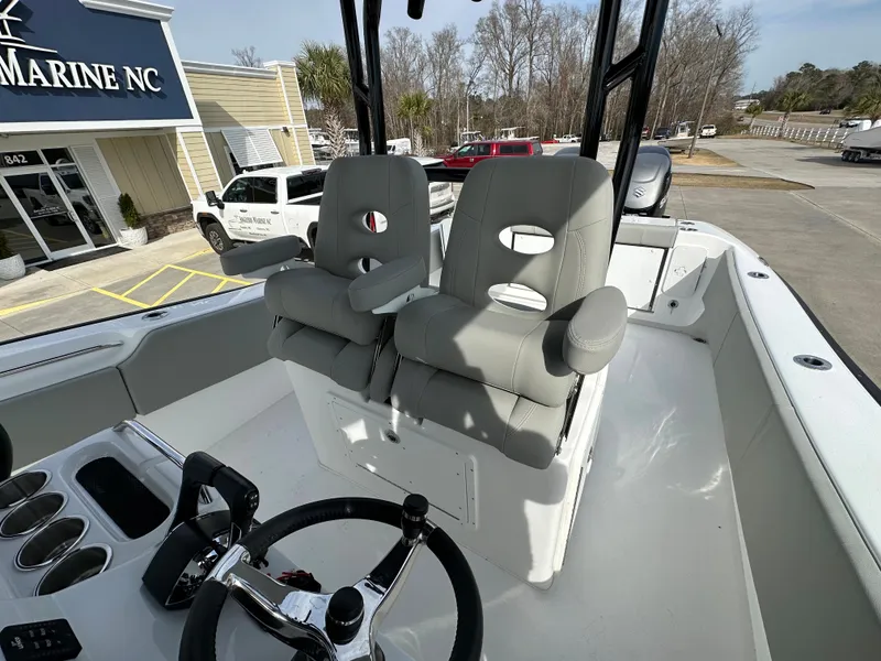 Slide: The Image of 2026 Cape Horn 32 XS boat interior with dual gray seats and steering wheel. - 20