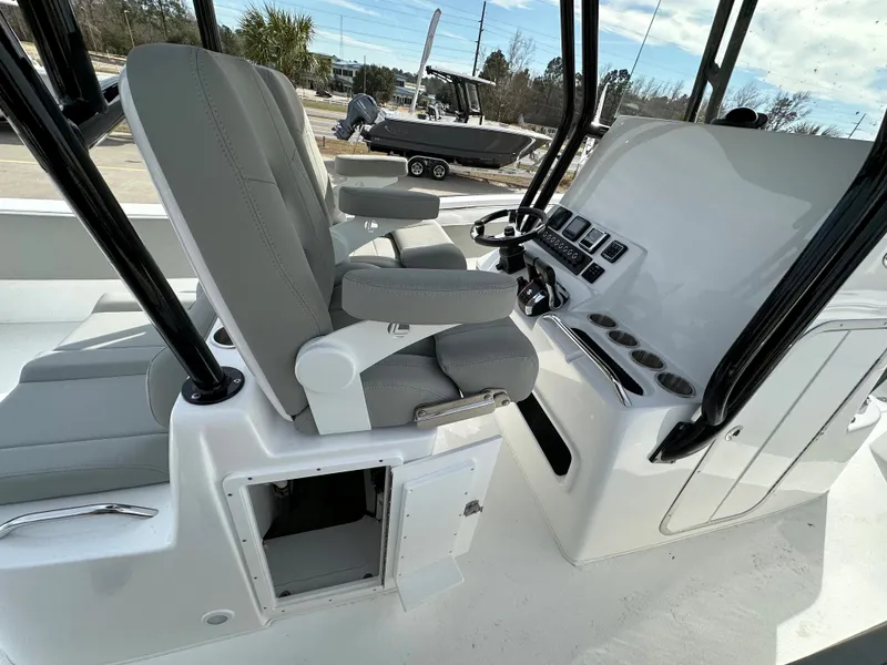 Slide: The Image of 2026 Cape Horn 32 XS boat interior with modern helm and seating. - 25