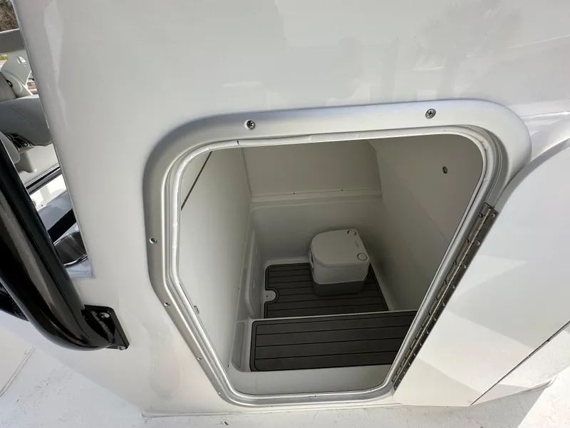 Slide: The Image of Interior view of 2026 Cape Horn 32 XS boat's compact bathroom with toilet. - 26