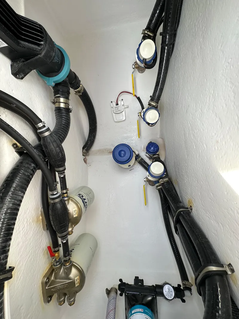 Slide: The Image of 2026 Cape Horn 32 XS boat plumbing system with hoses and fittings. - 13