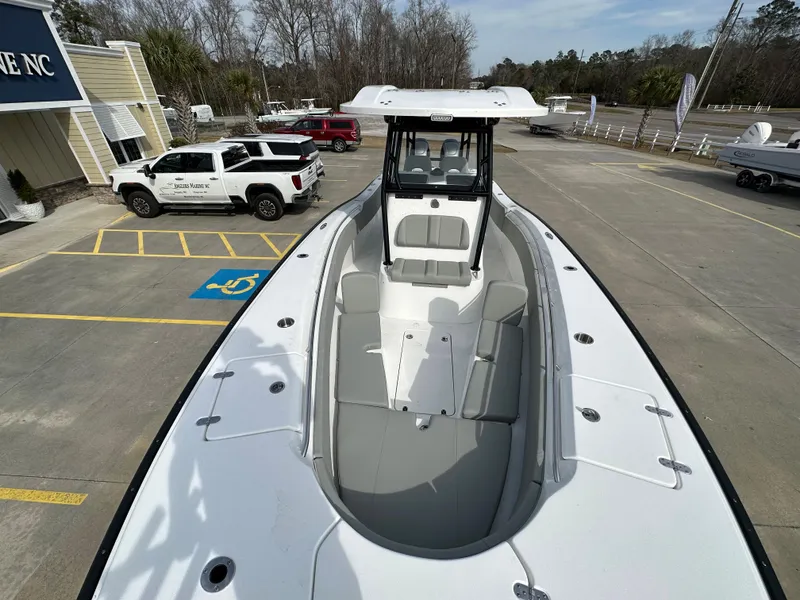 Slide: The Image of 2026 Cape Horn 32 XS boat in parking lot, showcasing spacious deck and modern design. - 7