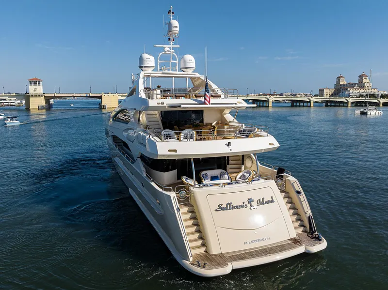 Slide: The Image of 2009 Sunseeker Trideck yacht cruising in a scenic harbor. - 10