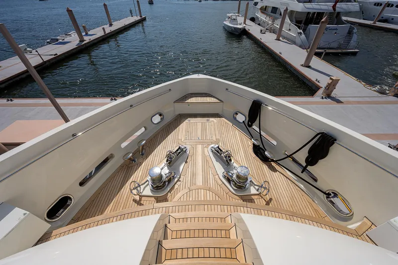 Slide: The Image of Sunseeker Trideck 2009 yacht bow with anchor winches and teak deck at marina. - 16