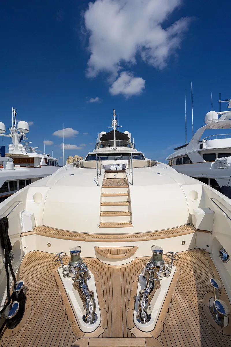 Slide: The Image of Luxurious 2009 Sunseeker Trideck yacht docked under a clear blue sky. - 18