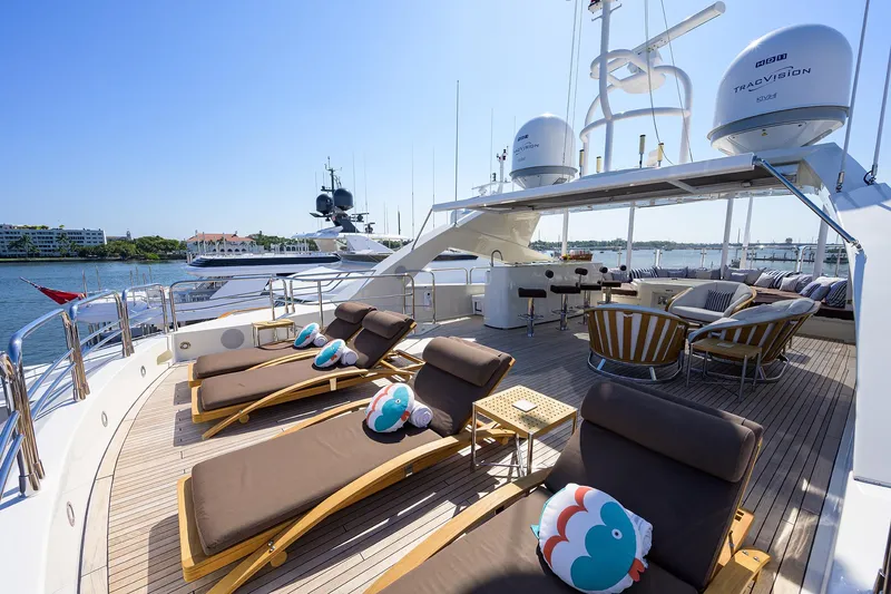 Slide: The Image of Sunseeker Trideck 2009 yacht with sun loungers and seating area on deck. - 23