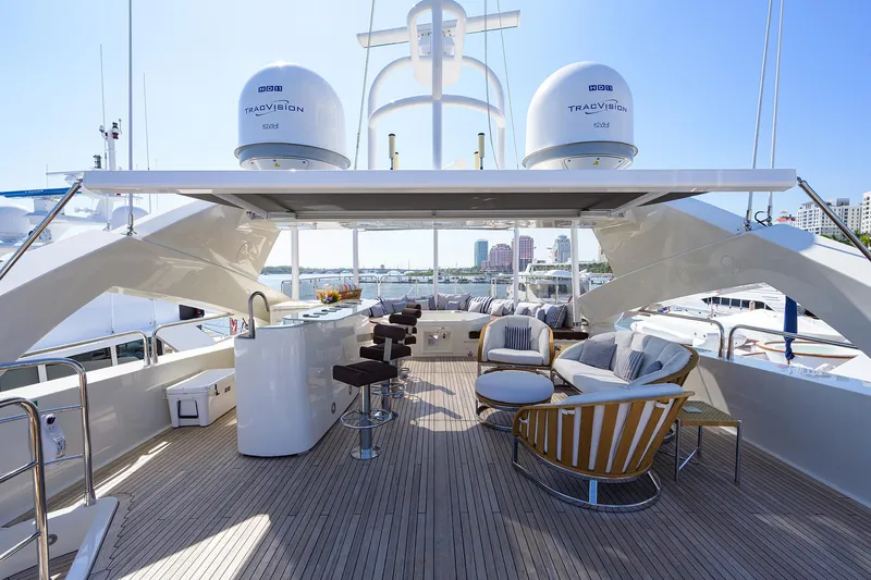 Slide: The Image of Luxurious 2009 Sunseeker Trideck yacht with spacious outdoor seating and bar area. - 25