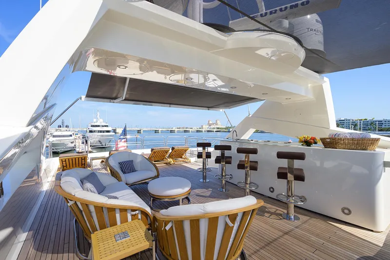 Slide: The Image of Luxurious 2009 Sunseeker Trideck yacht with outdoor seating and bar area in marina. - 28