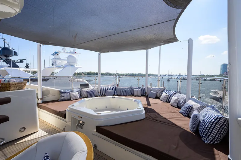 Slide: The Image of Luxurious 2009 Sunseeker Trideck yacht with spacious deck, hot tub, and waterfront view. - 29