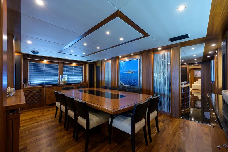 Slide: The Image of Luxurious dining area on a 2009 Sunseeker Trideck yacht with elegant wood finishes. - 36