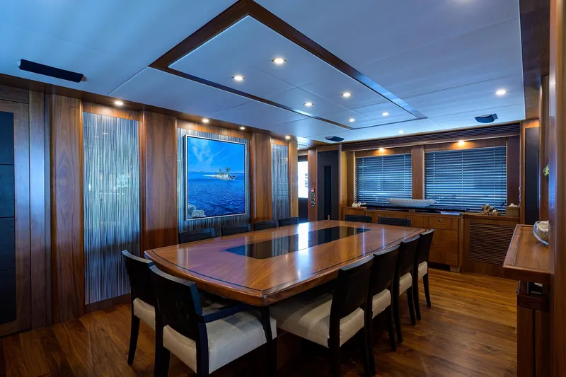 Slide: The Image of Luxurious dining area on a 2009 Sunseeker Trideck yacht with elegant wood finishes. - 37