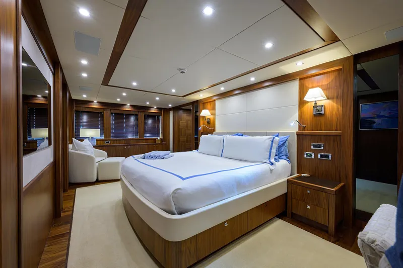 Slide: The Image of Luxurious bedroom on a 2009 Sunseeker Trideck yacht with modern wood finishes. - 45