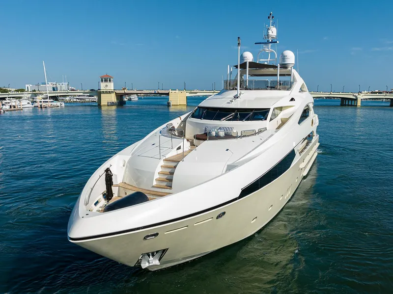 Slide: The Image of Luxurious 2009 Sunseeker Trideck yacht cruising in a serene marina. - 5
