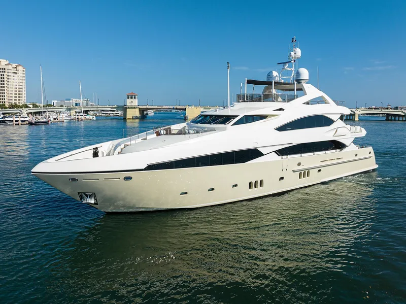 Slide: The Image of Luxurious 2009 Sunseeker Trideck yacht cruising in a marina under a clear blue sky. - 7