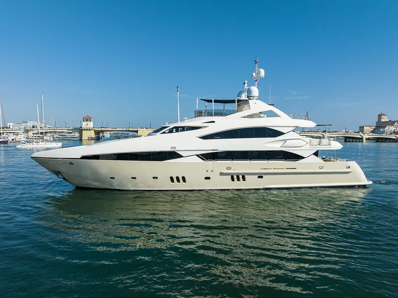 Slide: The Image of 2009 Sunseeker Trideck yacht cruising in a marina under a clear blue sky. - 8