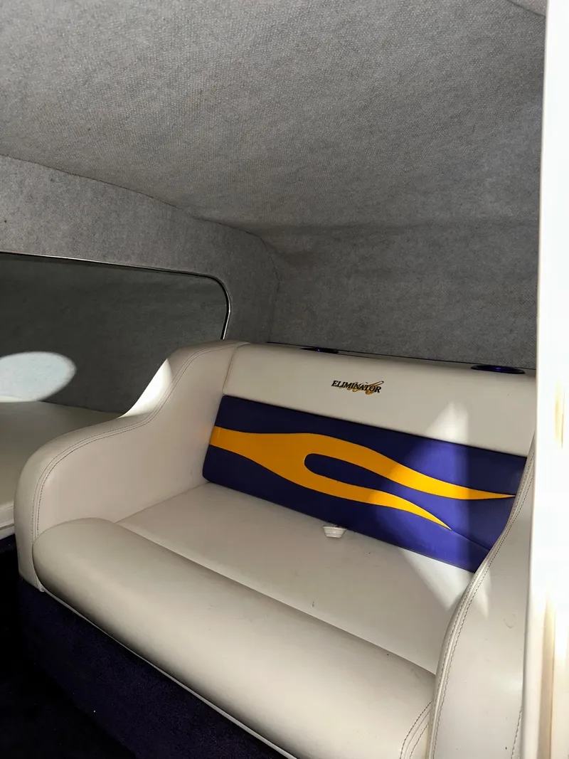 Slide: The Image of 2005 Eliminator 260 Eagle XP interior with white and blue seating. - 27