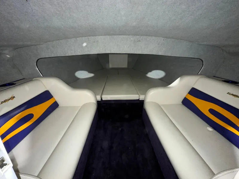 Slide: The Image of Interior of 2005 Eliminator 260 Eagle XP boat with cushioned seating. - 28