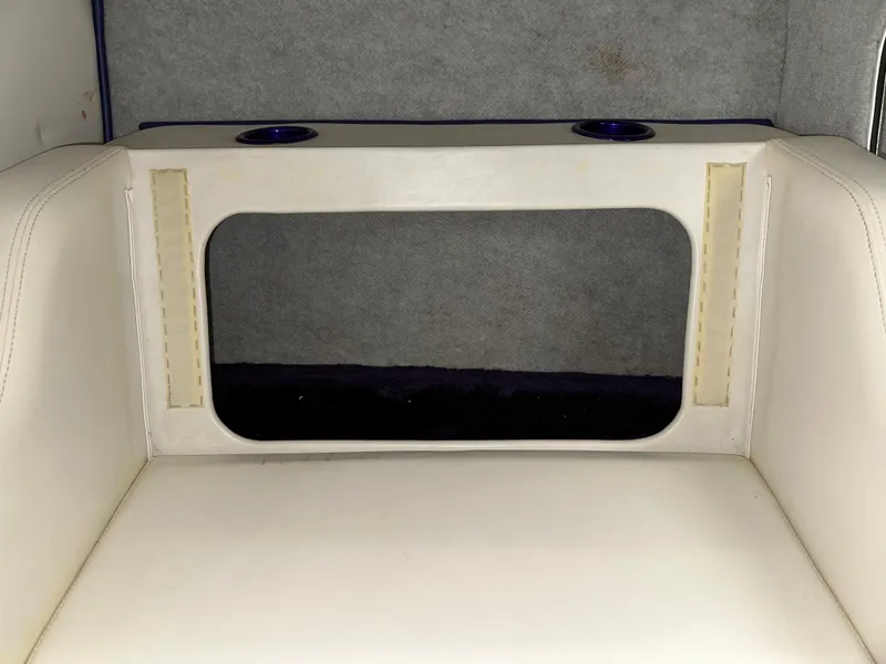 Slide: The Image of 2005 Eliminator 260 Eagle XP boat interior with white seating and cup holders. - 39