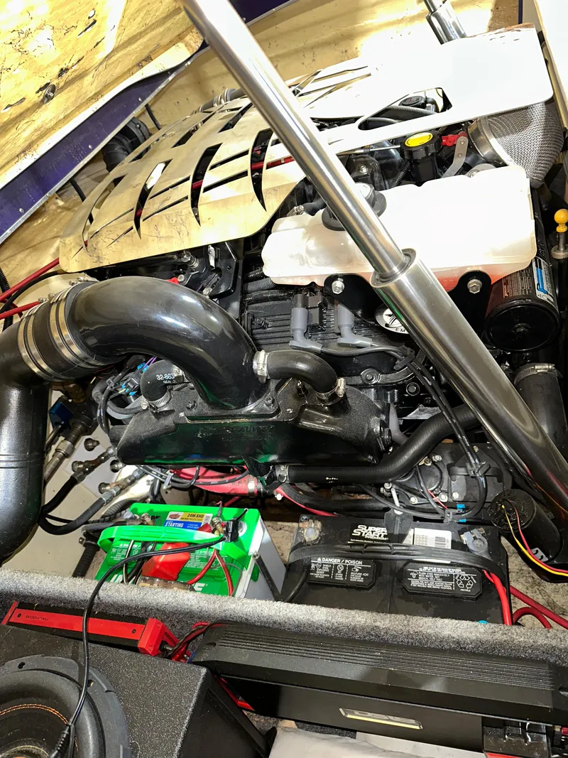 Slide: The Image of Engine compartment of a 2005 Eliminator 260 Eagle XP boat, showcasing mechanical components. - 46