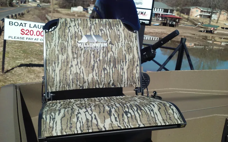 Slide: The Image of Camouflage boat seat on a 2023 Thor Lake Hammer Elite near a boat launch sign. - 10