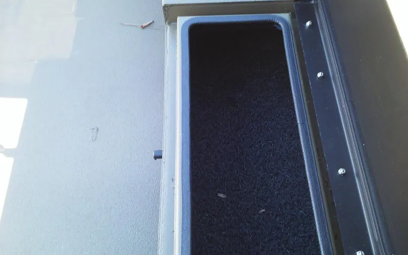 Slide: The Image of 2023 Thor Lake Hammer Elite storage compartment with black interior. - 12