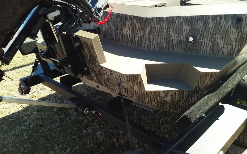 Slide: The Image of 2023 Thor Lake Hammer Elite boat on trailer, rear view showing motor mount and camouflage design. - 17