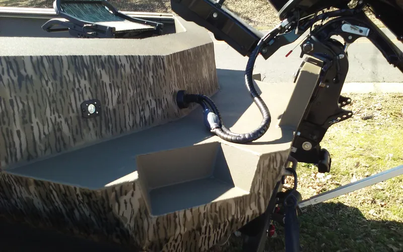 Slide: The Image of 2023 Thor Lake Hammer Elite boat with camouflage design and motor. - 20